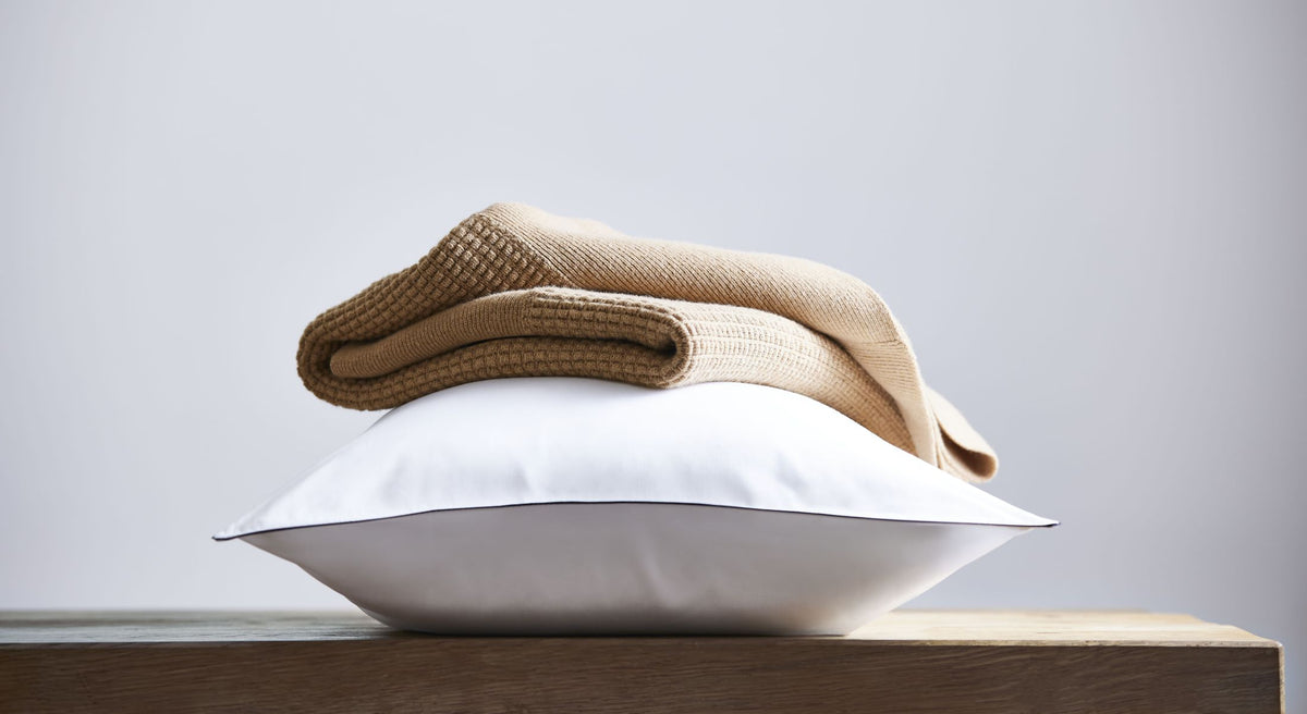 Signature image - Grosgain trim, white pillowcase, wool throw
